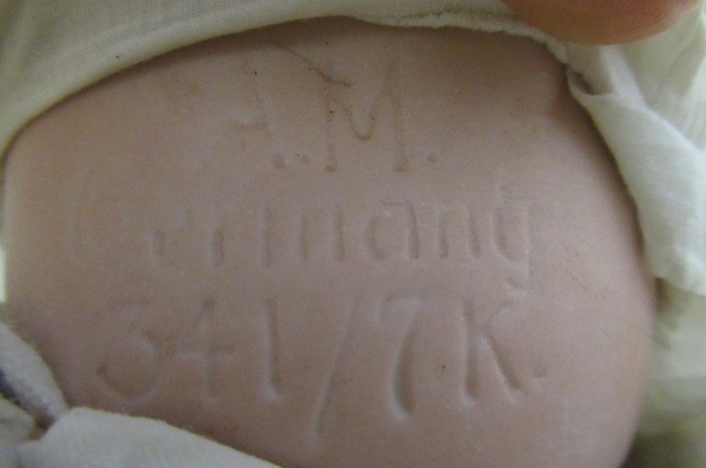 Two Armand Marseille bisque socket head baby dolls Image