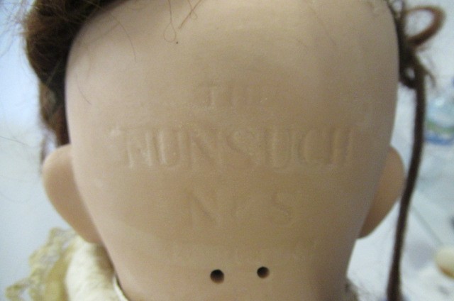 A "NUNSUCH" bisque socket head character doll Image