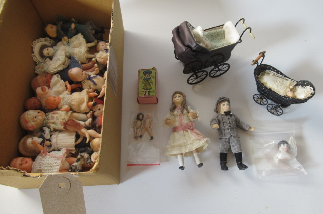 A collection of doll's house dolls Image
