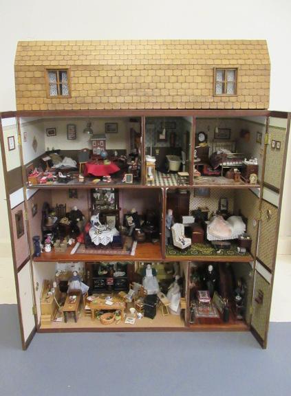 A large Georgian style doll's house and contents Image