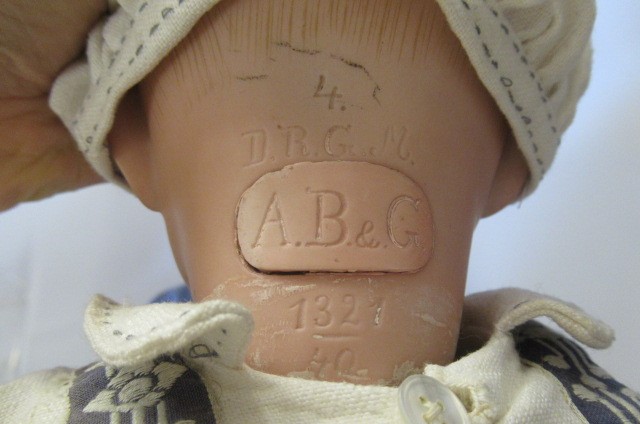 A rare Swaine & Co. bisque socket head solemn boy doll Image