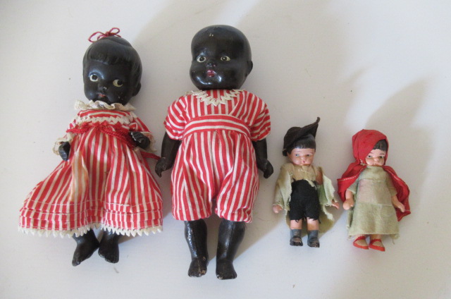 Four small jointed dolls Image