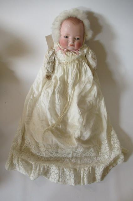 A bisque head flange neck baby doll Image