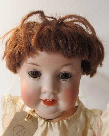 Two bisque socket head dolls Image