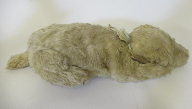 A Merrythought lying dog Image