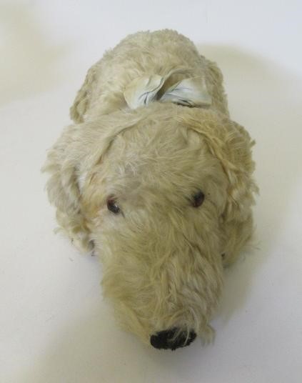 A Merrythought lying dog Image