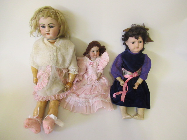 Three bisque socket head dolls Image