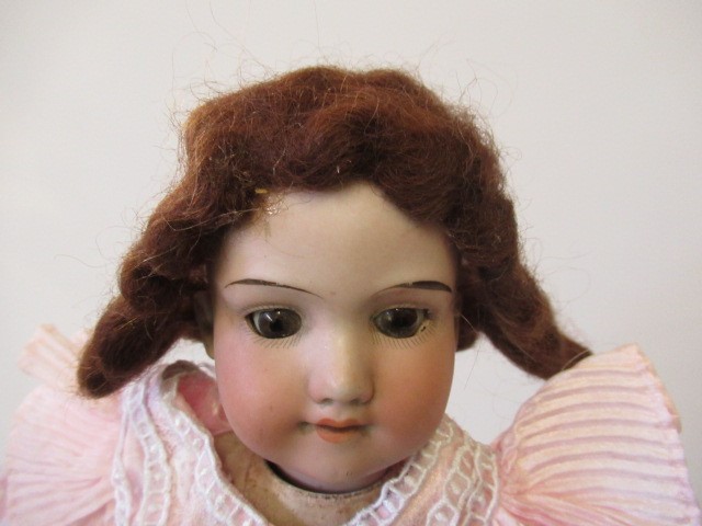 Three bisque socket head dolls Image