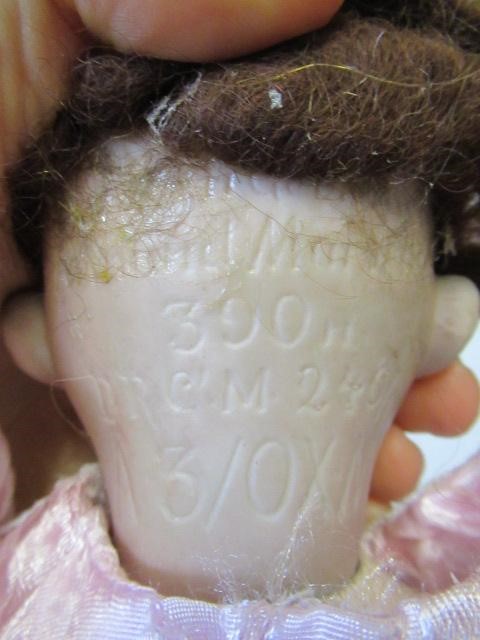 Three bisque socket head dolls Image