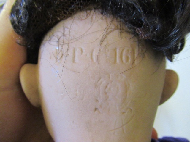 Three bisque socket head dolls Image