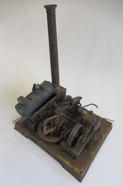 A stationary steam engine with dynamo single cylinder spirit fired engine driving dynamo to light Image