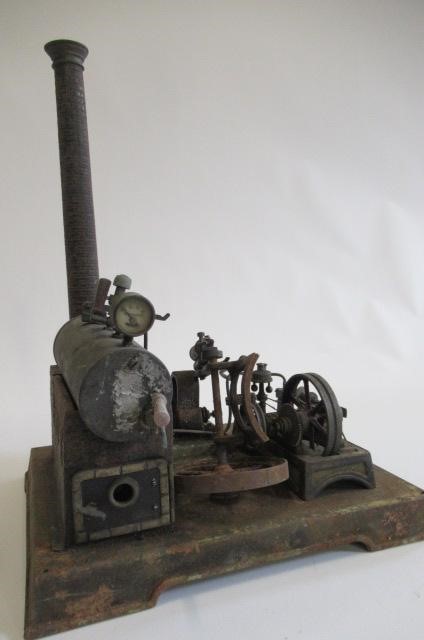 A stationary steam engine with dynamo single cylinder spirit fired engine driving dynamo to light Image