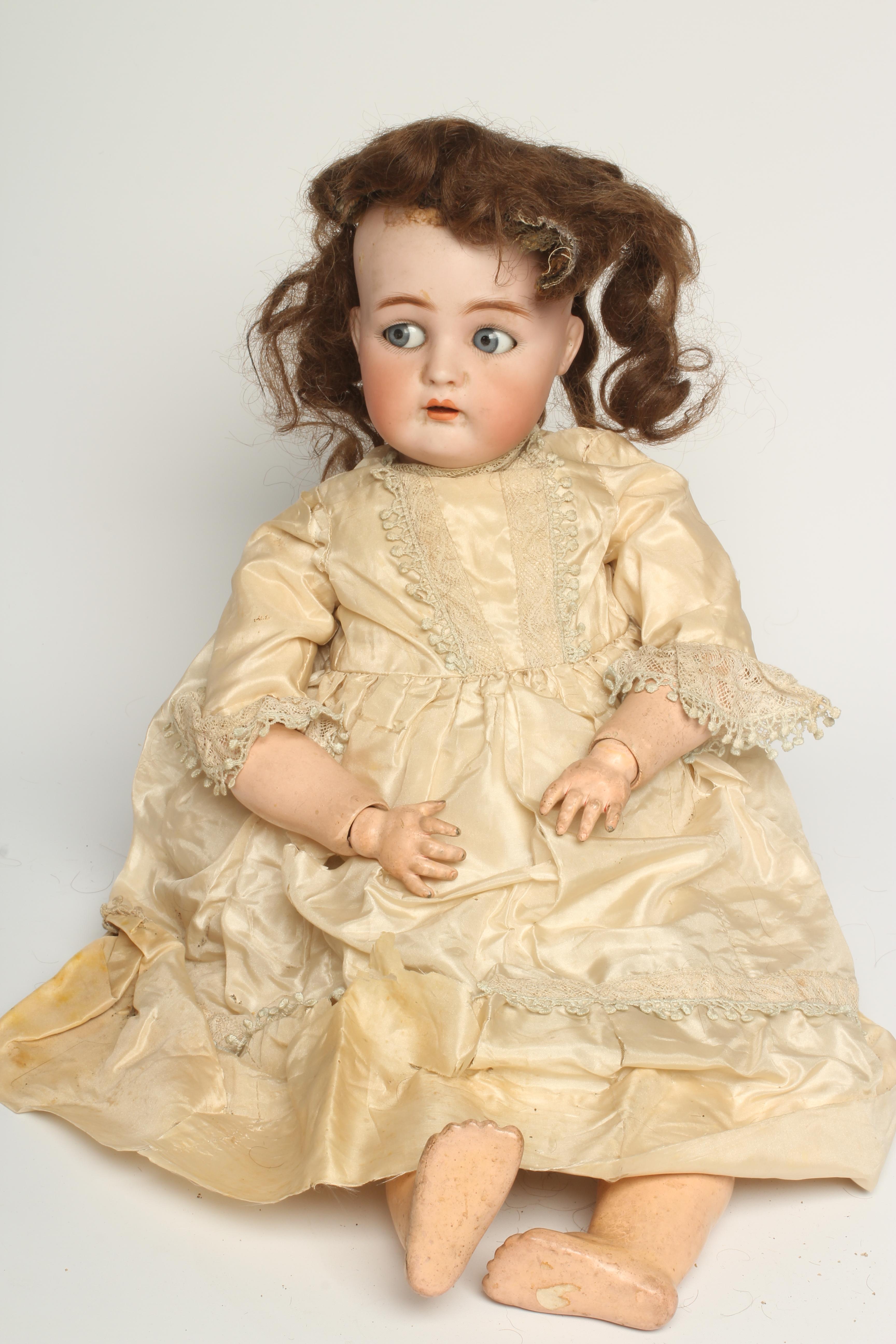 A Kammer & Reinhardt bisque socket head flirty doll Image