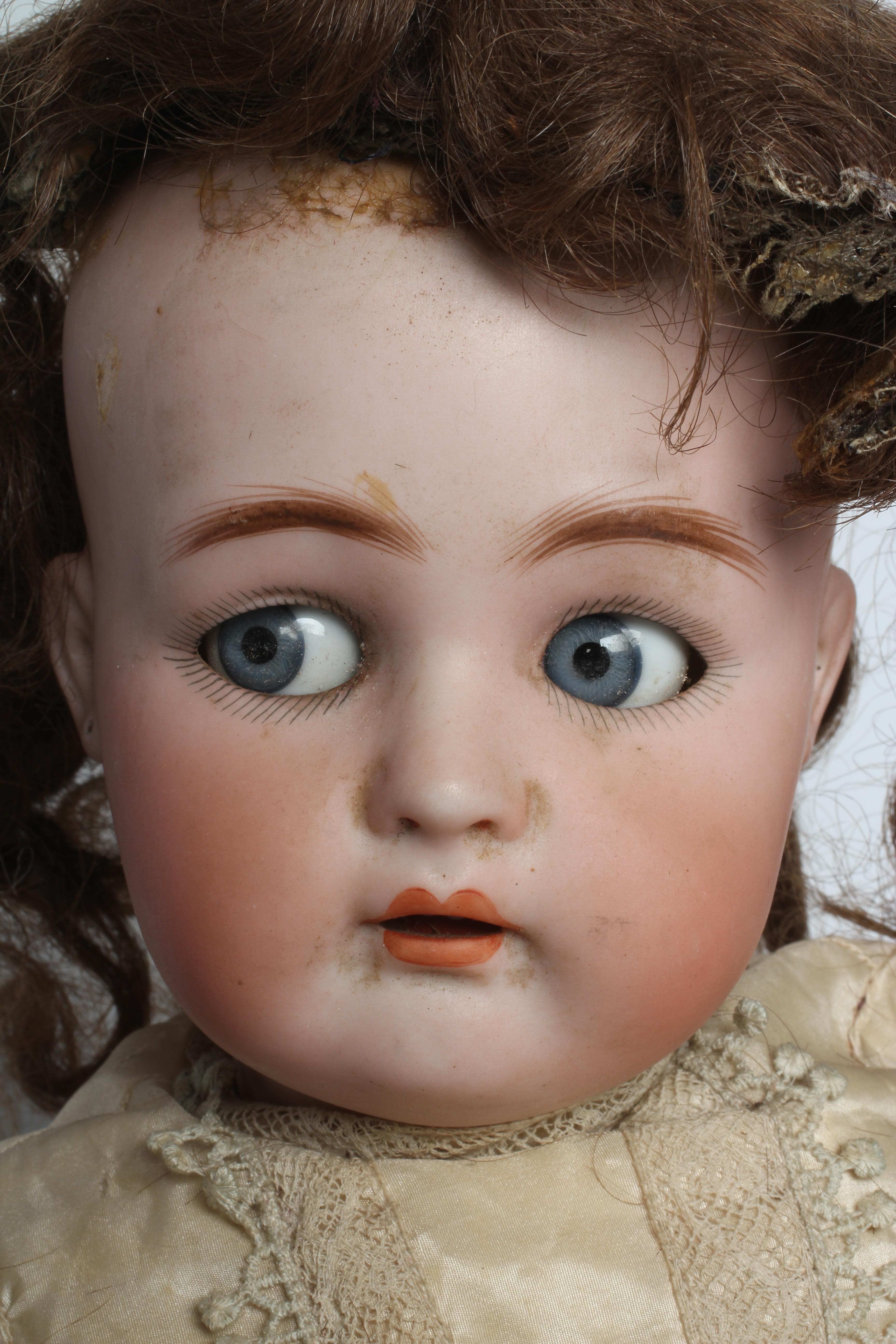 A Kammer & Reinhardt bisque socket head flirty doll Image