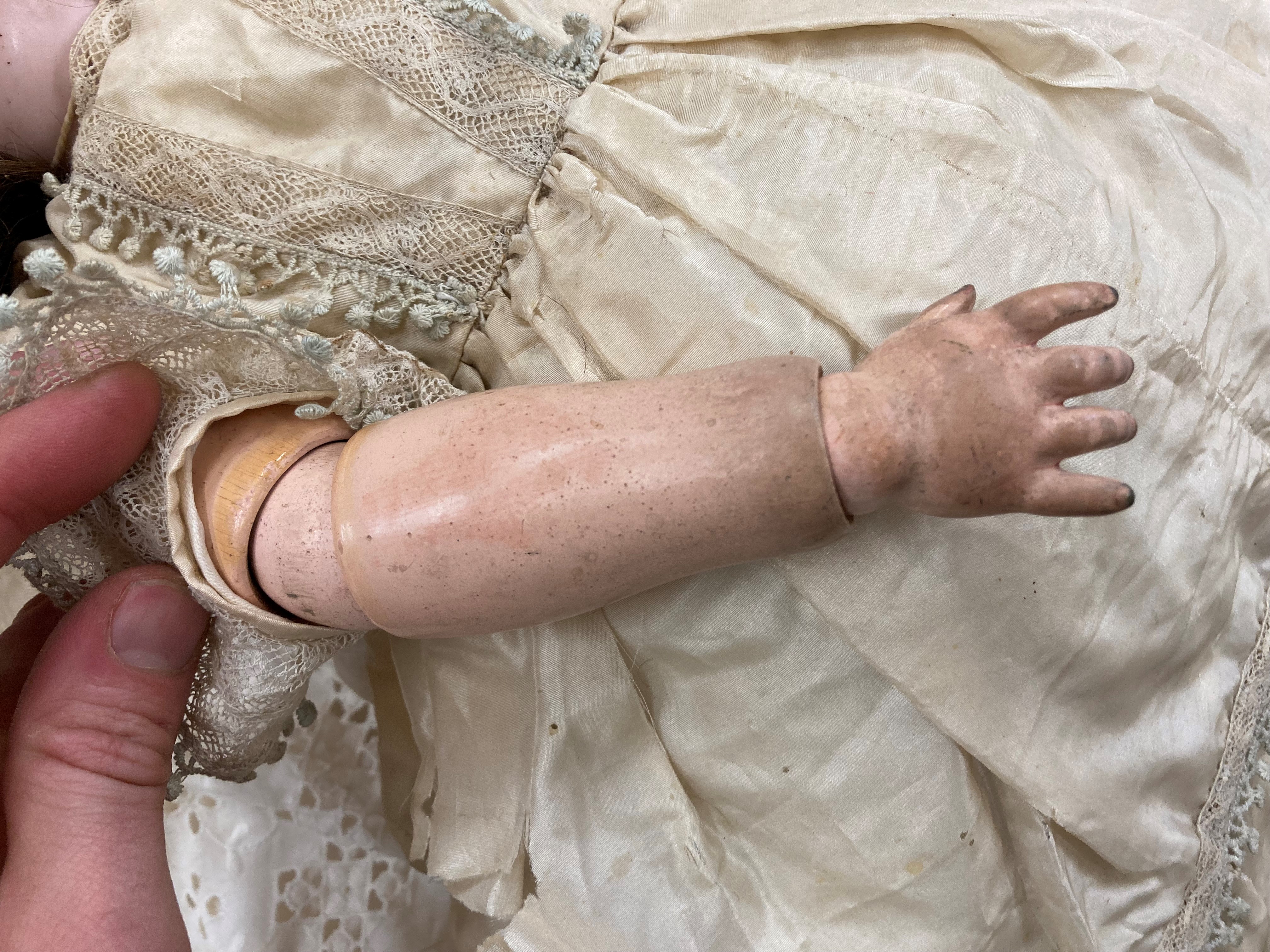 A Kammer & Reinhardt bisque socket head flirty doll Image