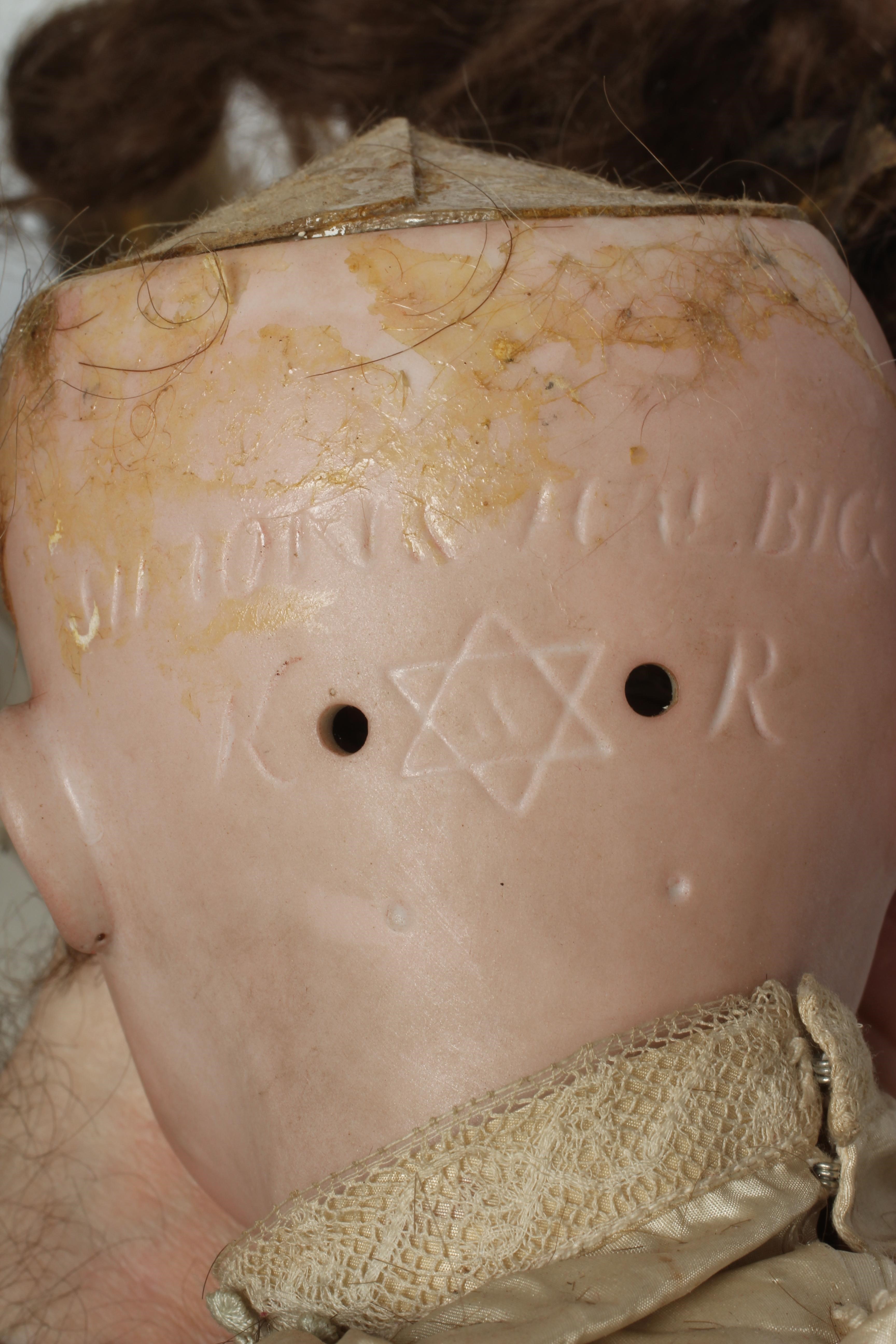 A Kammer & Reinhardt bisque socket head flirty doll Image