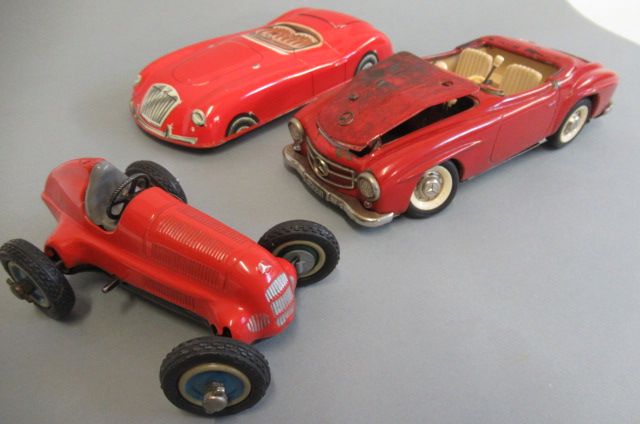 Schuco 1050 race car in red and playworn Schuco 5503 Elektro Car Image