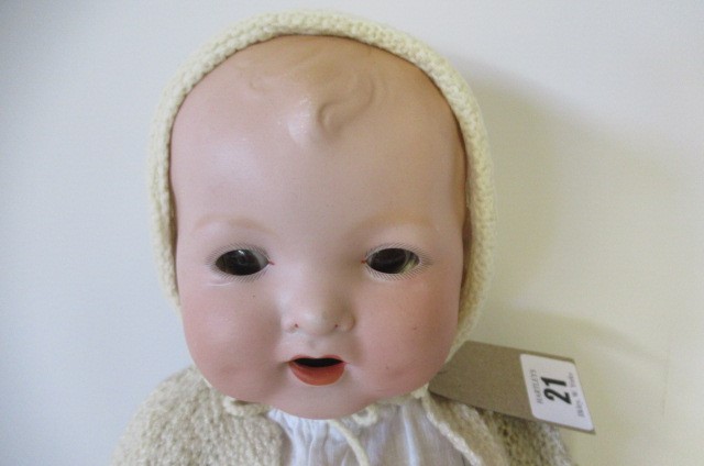 A Baby Gloria bisque flange neck doll Image