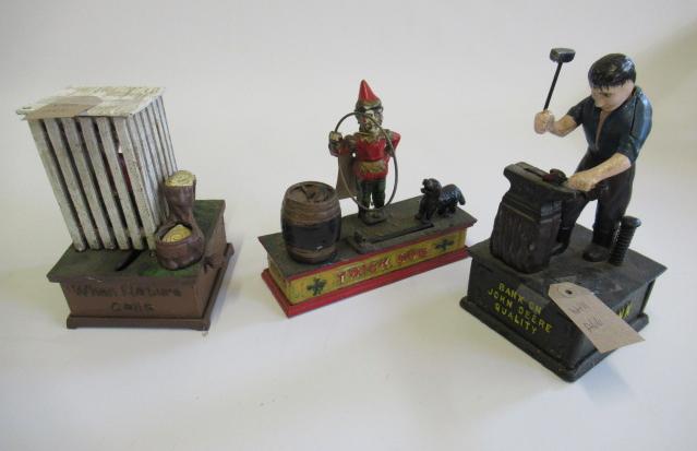 Three cast iron novelty money boxes comprising clown Image