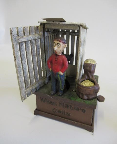 Three cast iron novelty money boxes comprising clown Image