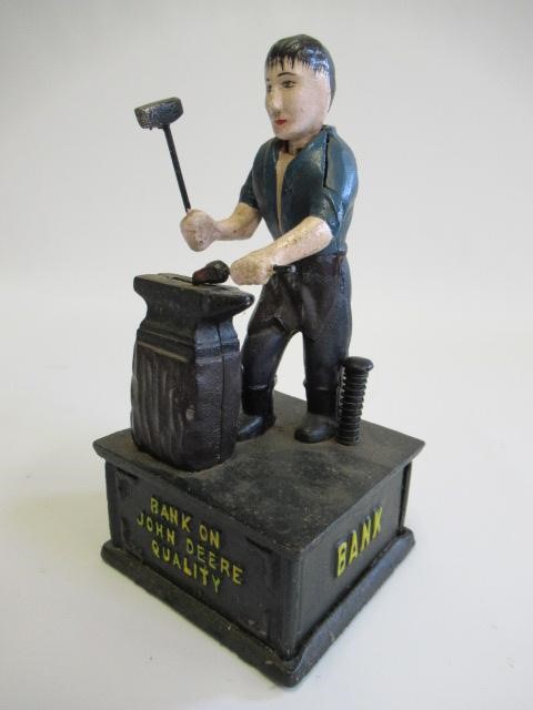 Three cast iron novelty money boxes comprising clown Image