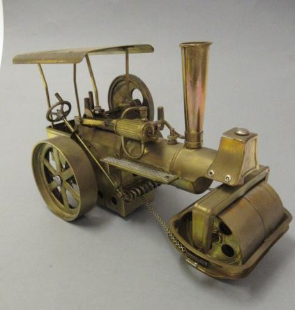 A Wilesco Old Smoky Steam Roller finished in brass Image