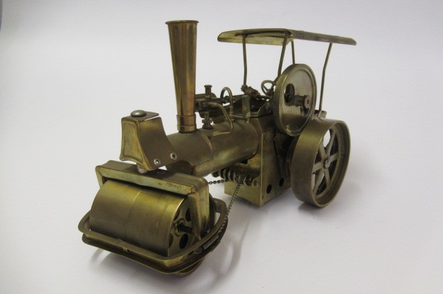 A Wilesco Old Smoky Steam Roller finished in brass Image
