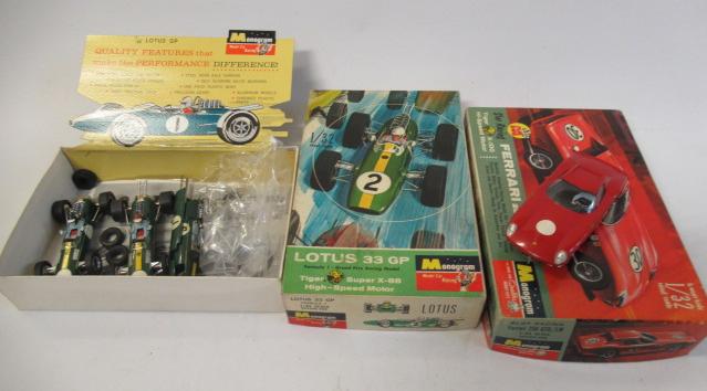 Monogram 1:32 12v slot race cars comprising two Lotus 33 GP cars and Ferrari GTO 250 LM car kit Image