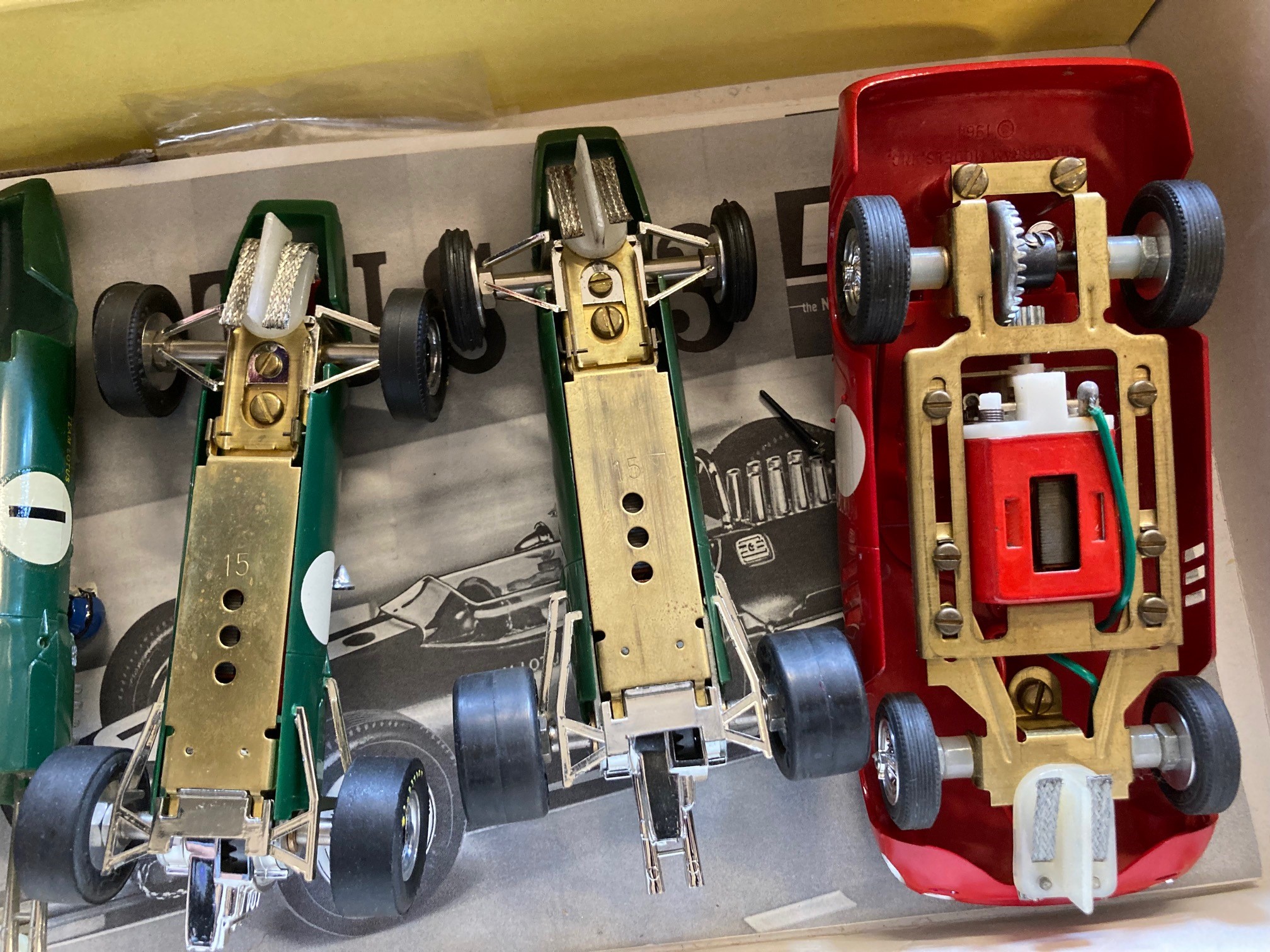 Monogram 1:32 12v slot race cars comprising two Lotus 33 GP cars and Ferrari GTO 250 LM car kit Image