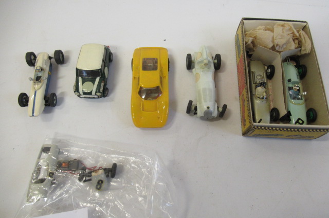 Seven slot racing cars by Airfix and others including Mini Cooper Image