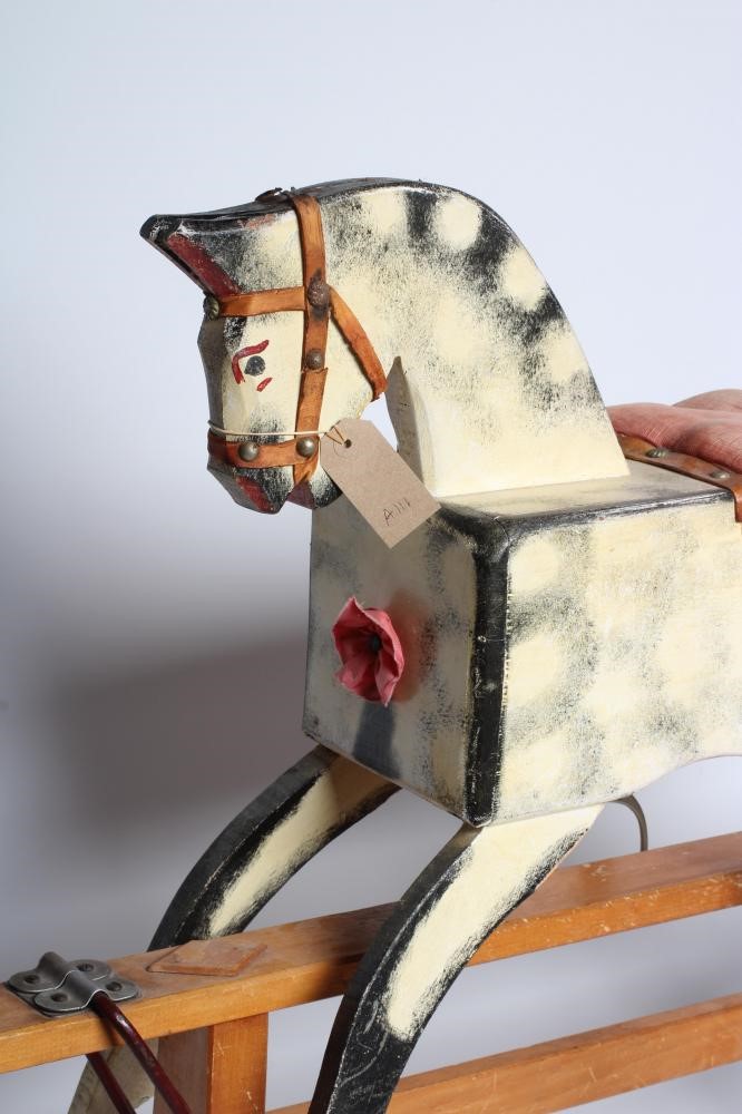 A wooden rocking horse Image