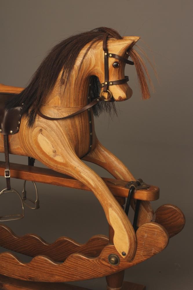 An Ian Armstrong rocking horse of carved laminate form Image