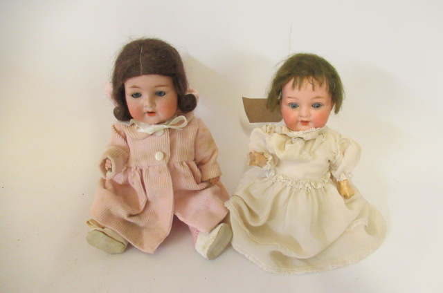 Two Armand Marseille bisque socket head dolls Image