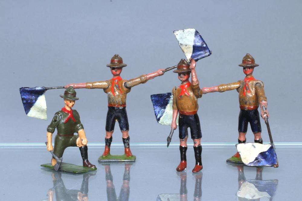 Two Britains Boy Scout signallers and two Britains Boy Scouts with axes Image