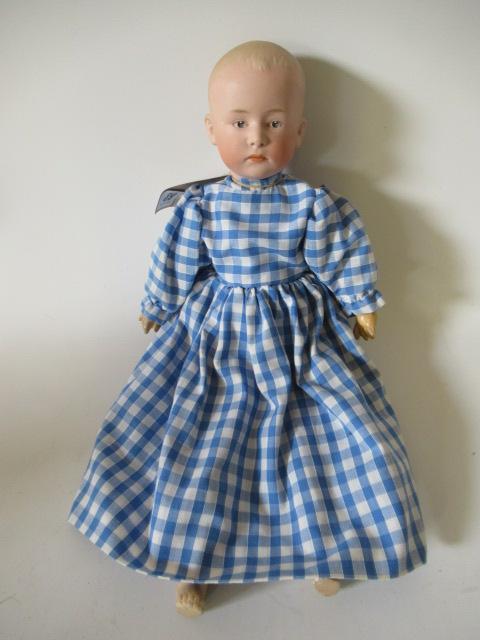 A Heubach bisque socket head solemn boy Image