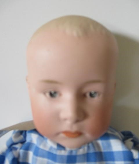 A Heubach bisque socket head solemn boy Image