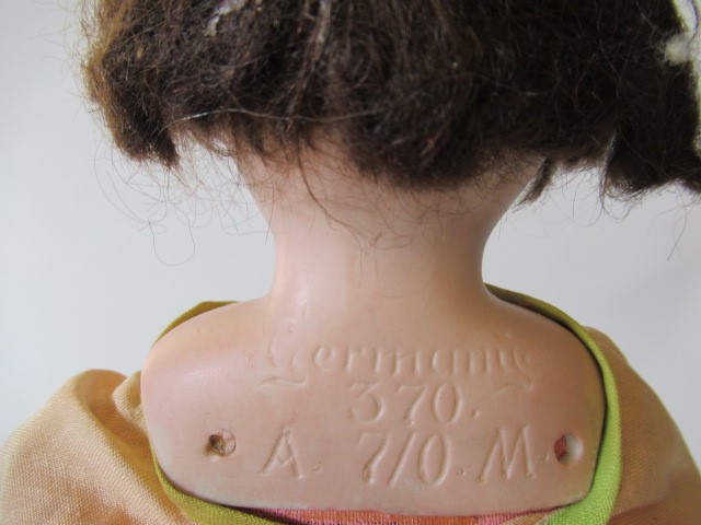 Four bisque head dolls Image