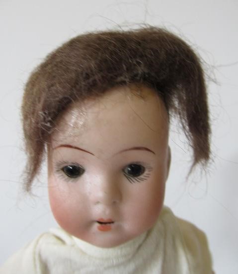Four bisque head dolls Image