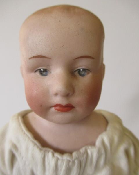 Four bisque head dolls Image