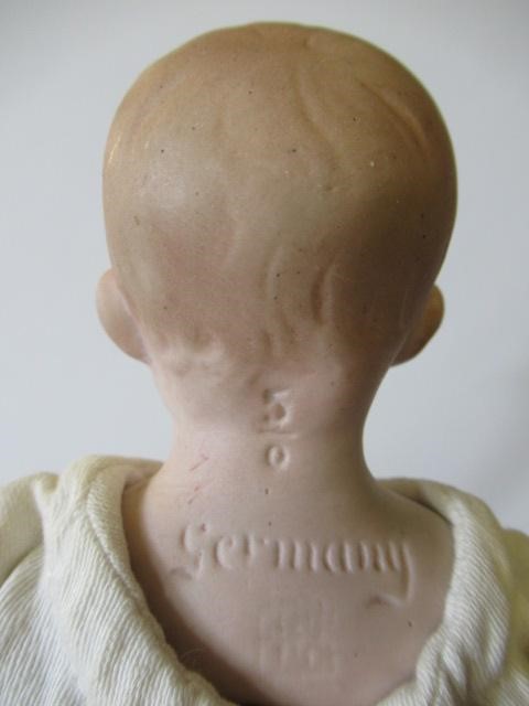Four bisque head dolls Image