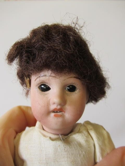 Four bisque head dolls Image