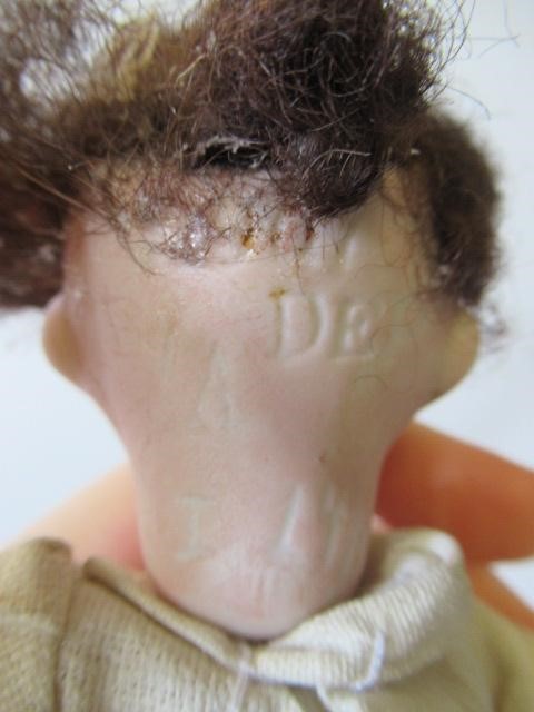 Four bisque head dolls Image