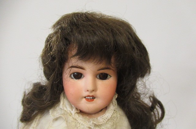 Two bisque socket head dolls Image