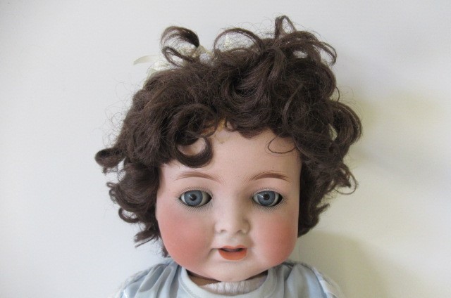 A Heubach Koppelsdorf bisque socket head flirty doll Image