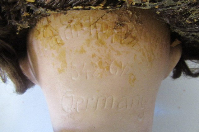 A Heubach Koppelsdorf bisque socket head flirty doll Image