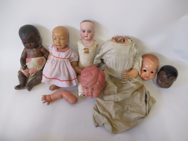 A quantity of dolls and doll parts Image