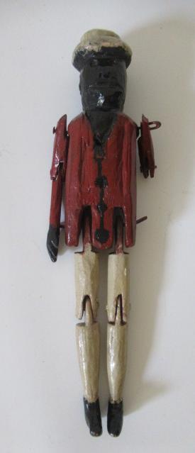 An antique wooden peg doll Image