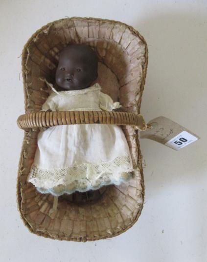 An Armand Marseille bisque black baby doll Image