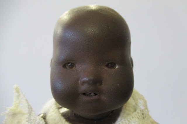An Armand Marseille bisque black baby doll Image