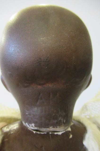 An Armand Marseille bisque black baby doll Image